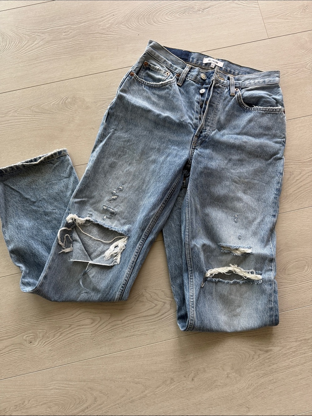 Woman’s Distressed Light Blue Denim Jeans